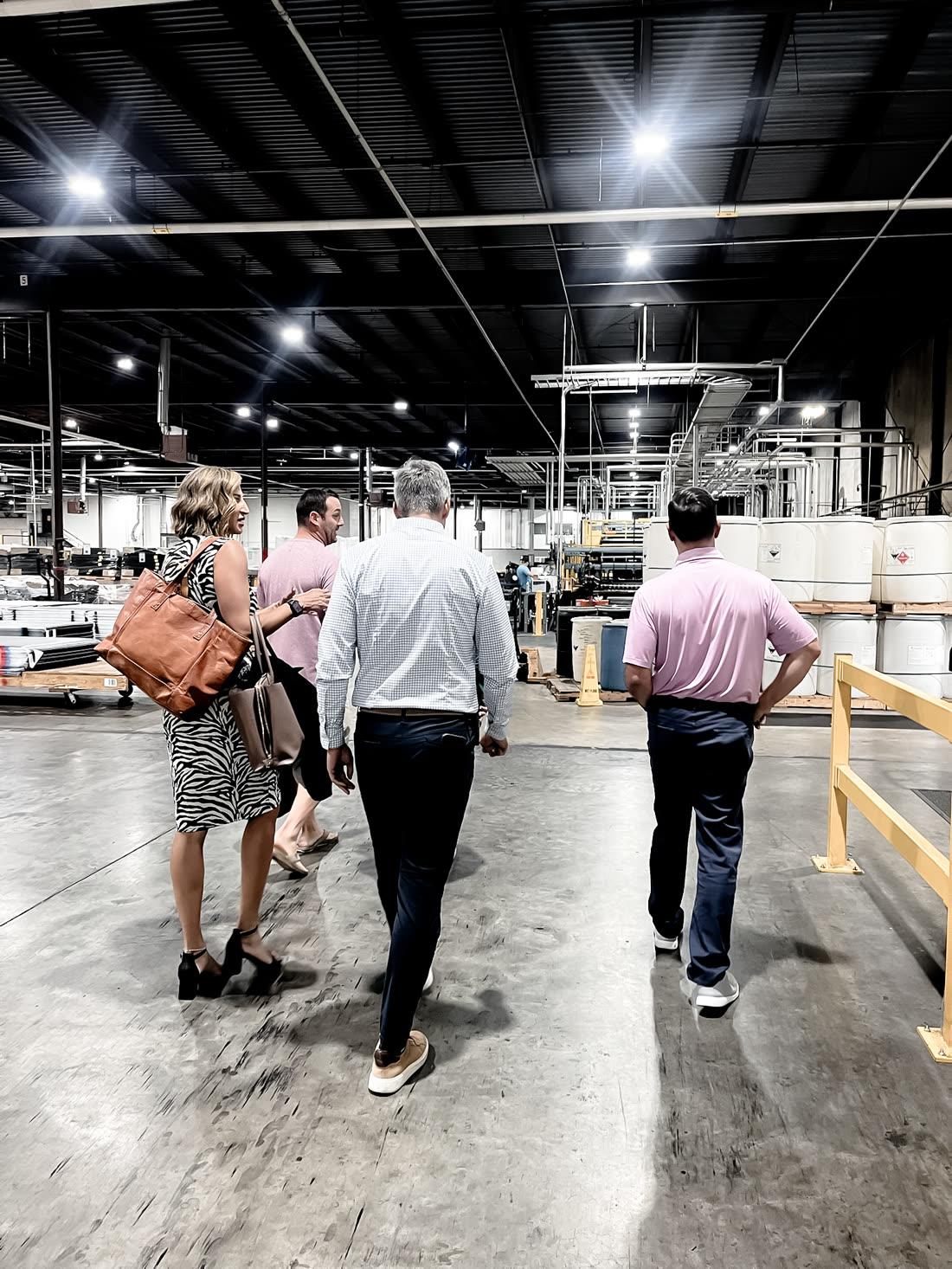The Triad walking a client through a distribution warehouse floor